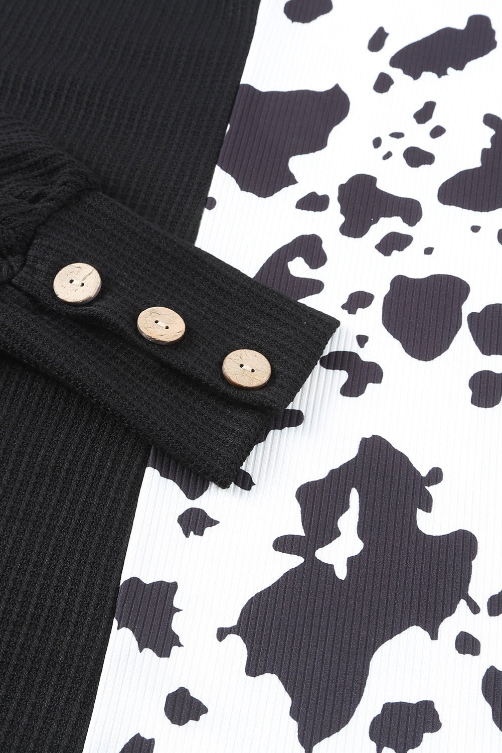 Top a maniche lunghe in maglia waffle patchwork di mucca nera