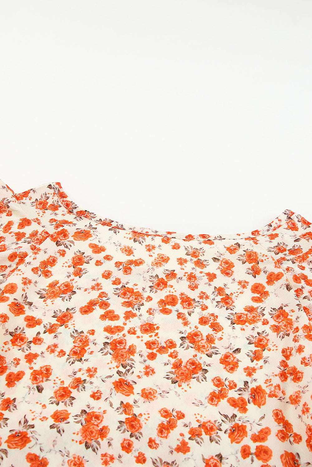 Narančasta bluza s lepršavim rukavima s cvjetnim uzorcima
