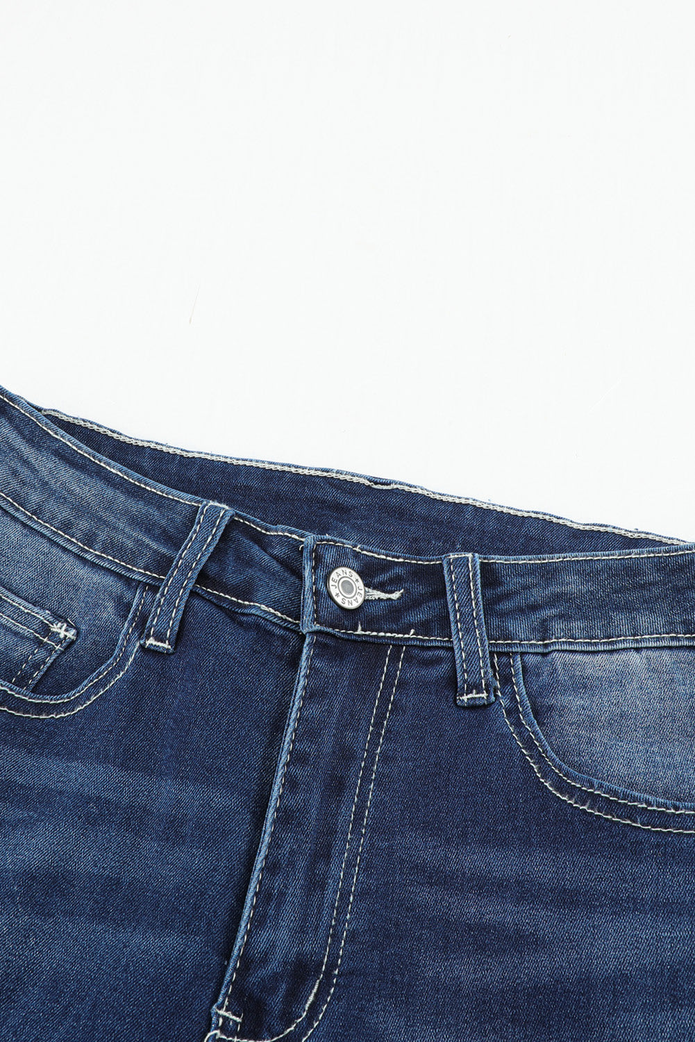 Jeans blu a vita media con bottoni e orlo grezzo invecchiato