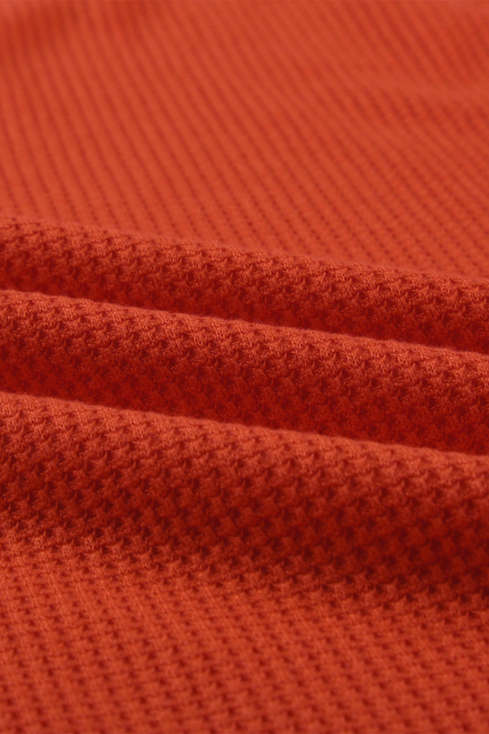 Orangefarbenes Oberteil mit V-Ausschnitt und Leopardenstreifen und Spleißlaternenärmeln