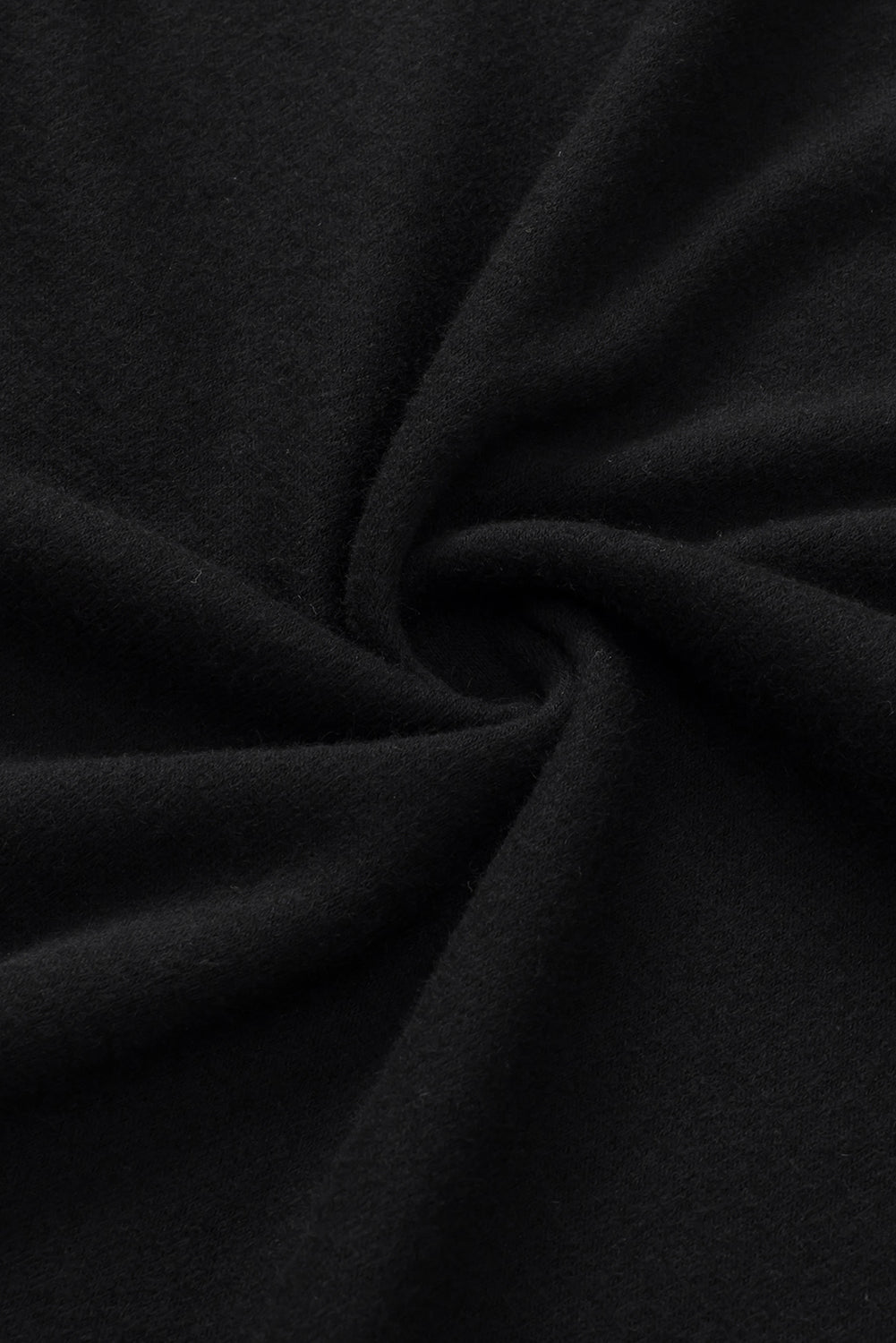 Zgornja stran tunike s kratkimi mehurčastimi rokavi in ​​potiskom črne marjetice
