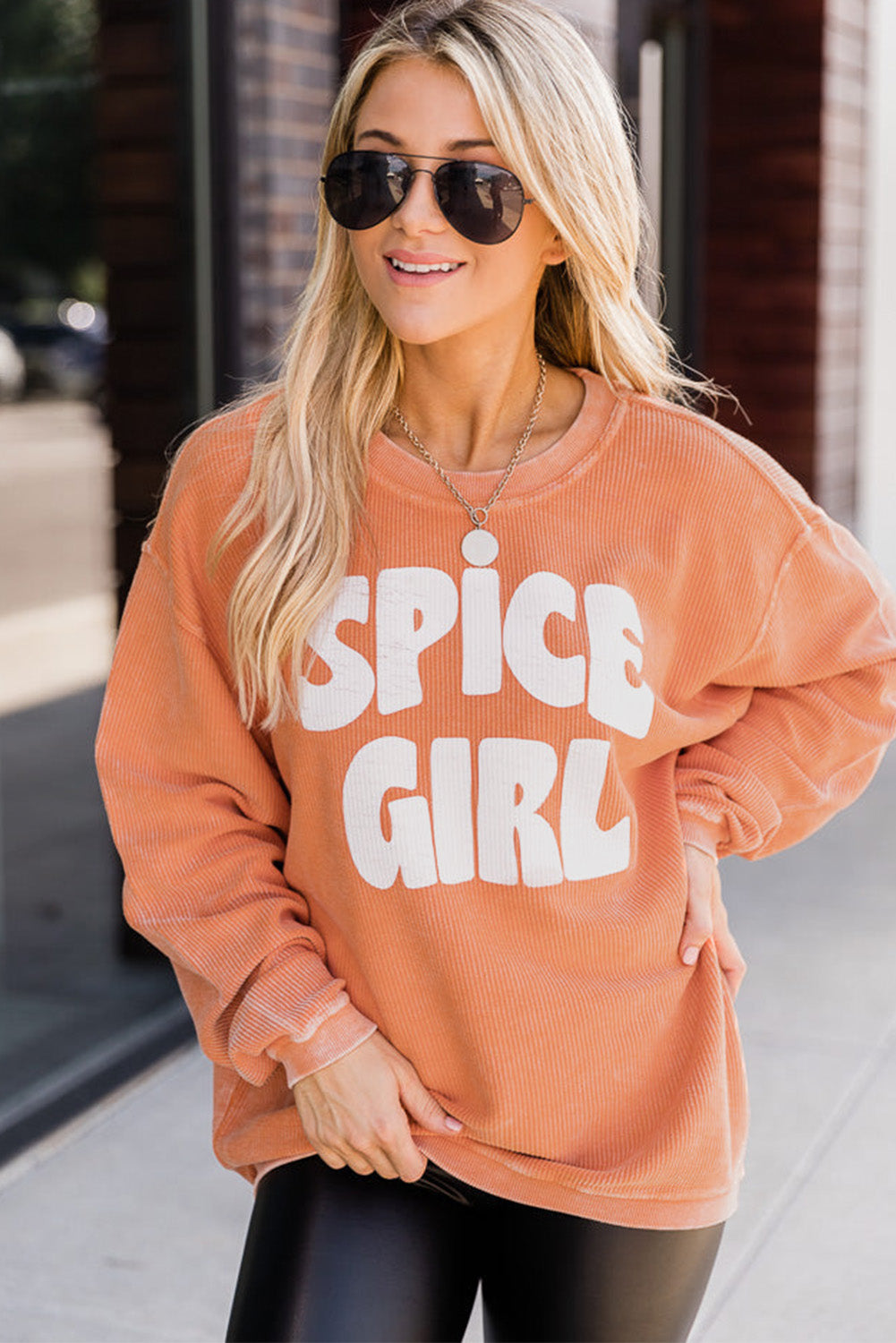 Oranžna pulover z grafiko SPICY GIRL na vrvici