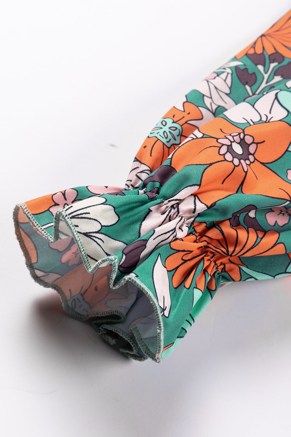 Camicetta peplo con maniche a sbuffo e stampa floreale stampata