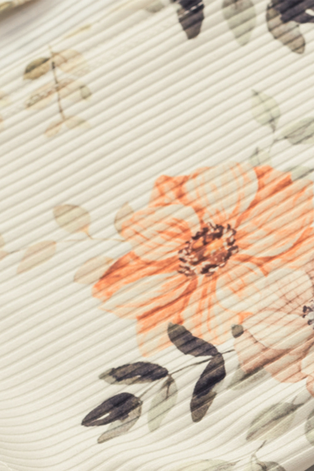 Strickjacke in schmaler Passform aus geripptem Strick mit Aprikosen-Blumendruck