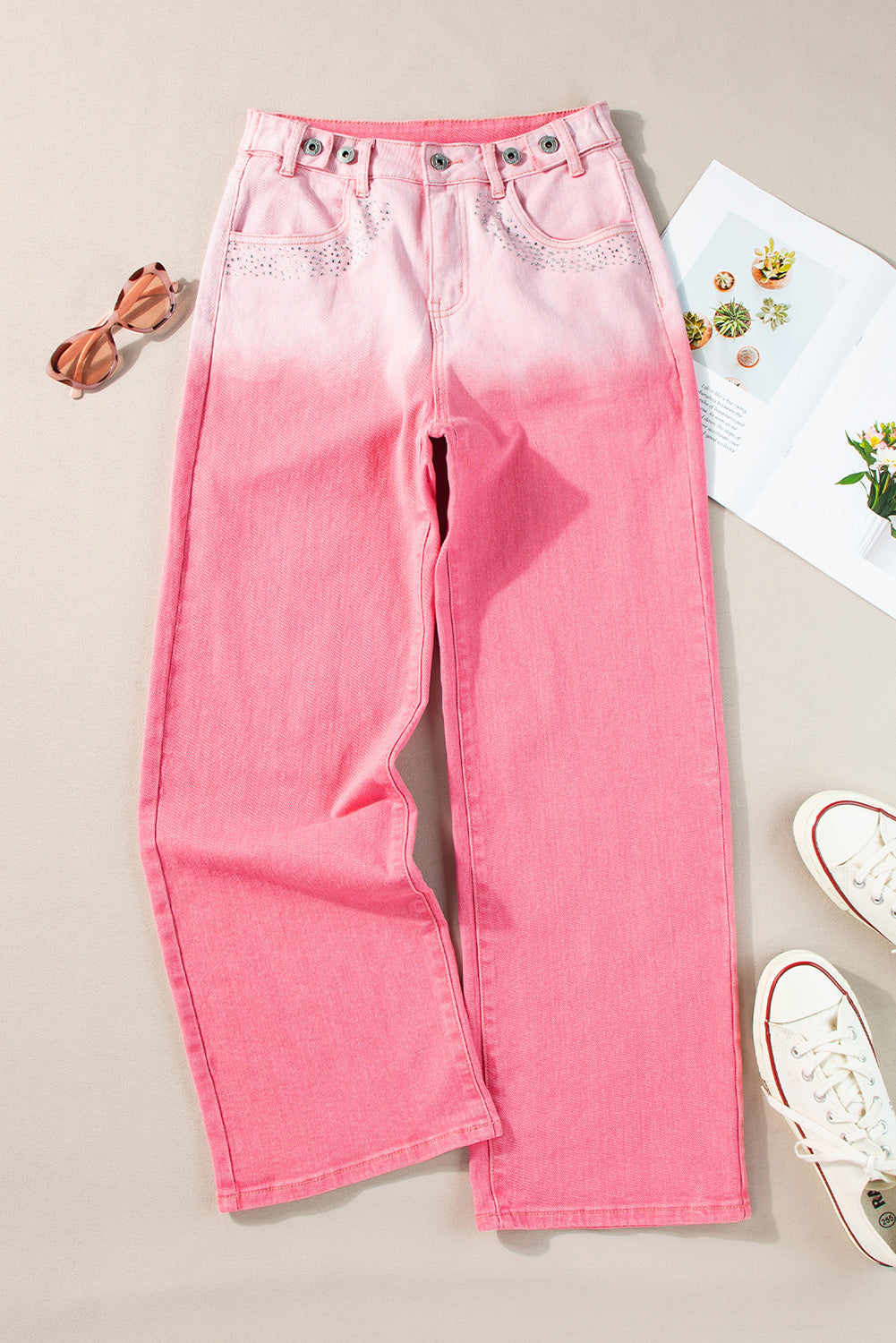 Pantaloni in denim sfumato con strass rosa