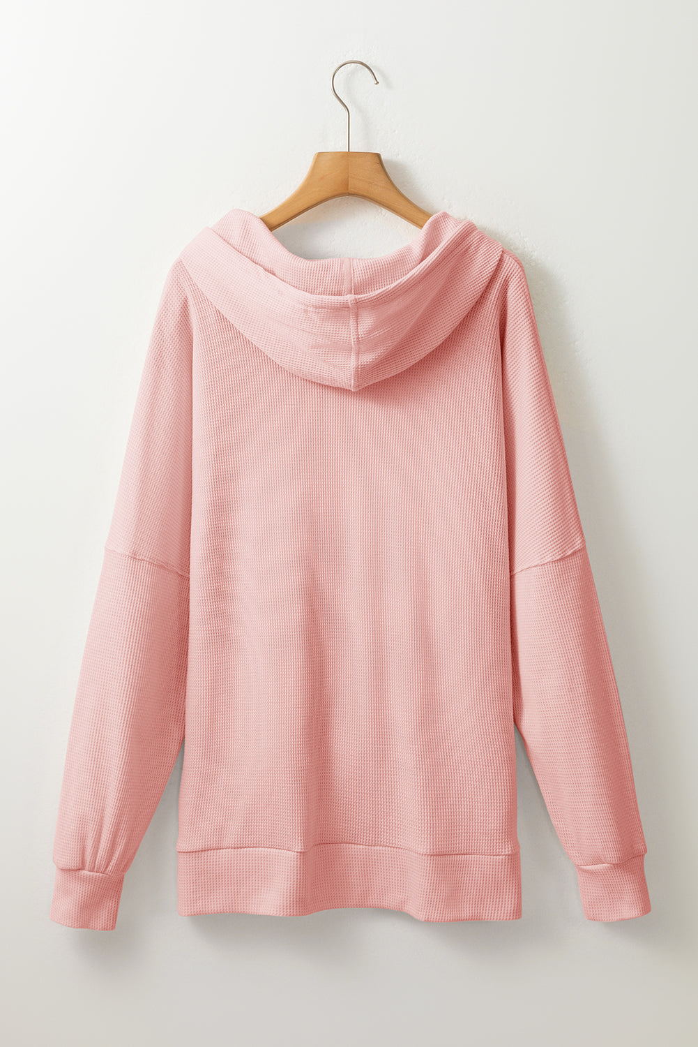 Sweat à capuche surdimensionné haut bas rose clair en tricot gaufré doublé de polaire