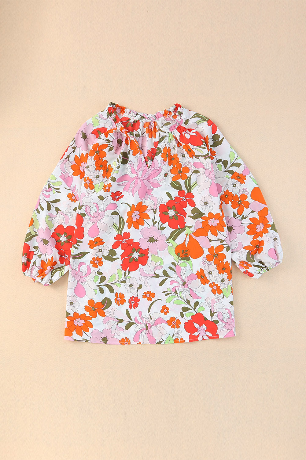 Bluza z napihnjenimi rokavi in ​​obrobo z oranžnimi cvetovi