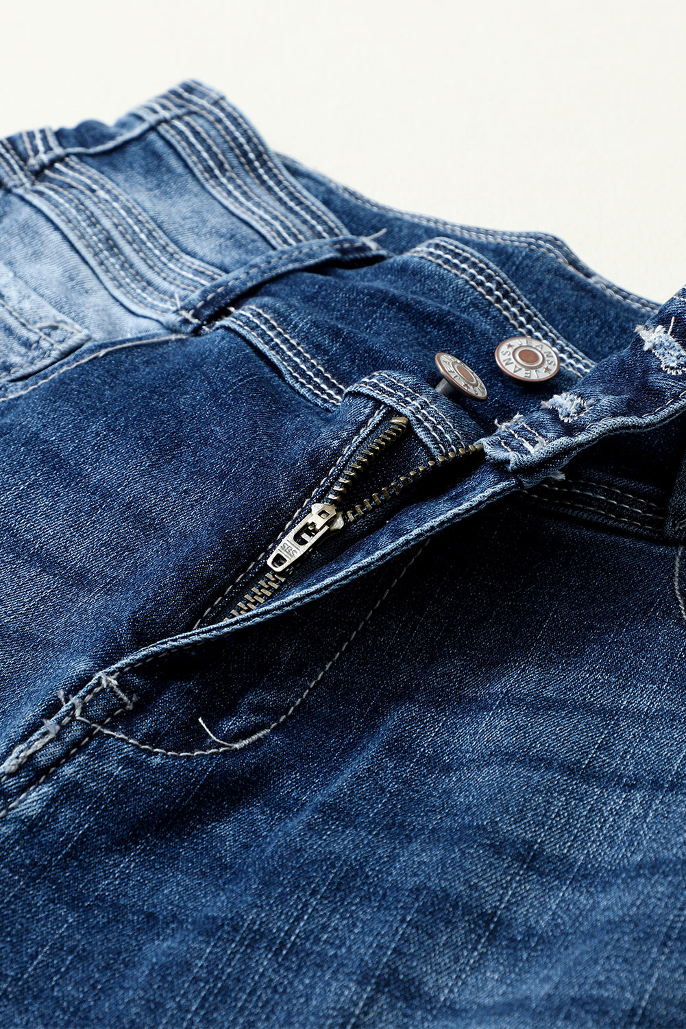 Jean skinny taille haute bleu délavé vintage à deux boutons
