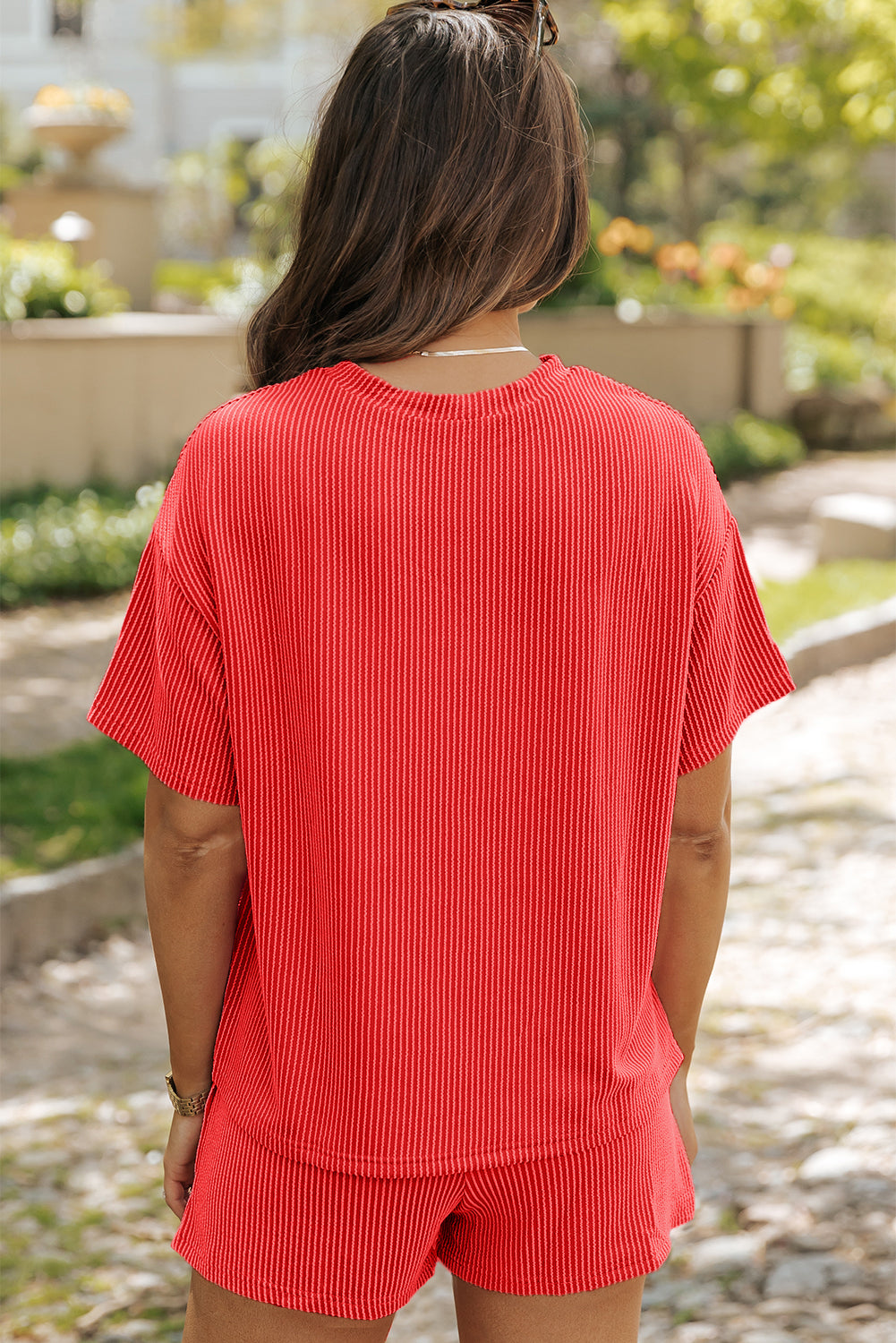 Orangefarbenes, geripptes, strukturiertes Strick-T-Shirt mit lockerer Passform und Shorts-Set