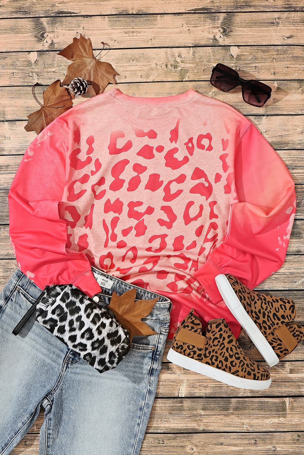 Sweat-shirt rose à imprimé guépard blanchi