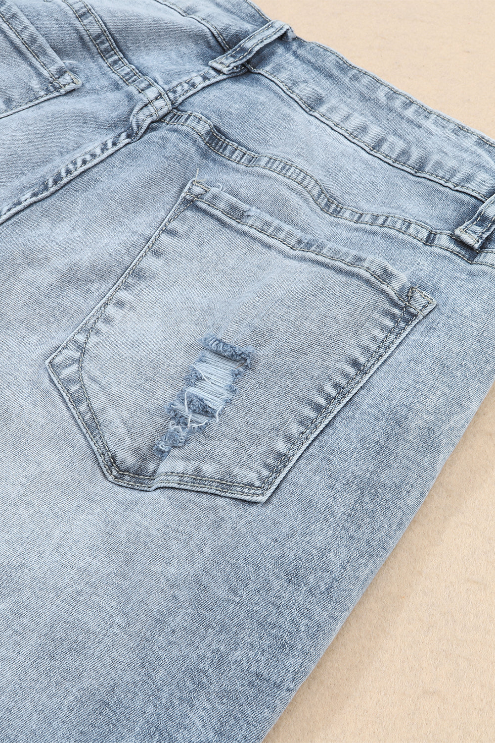 Jeans slim fit sfilacciati a vita alta blu navy con lavaggio chiaro