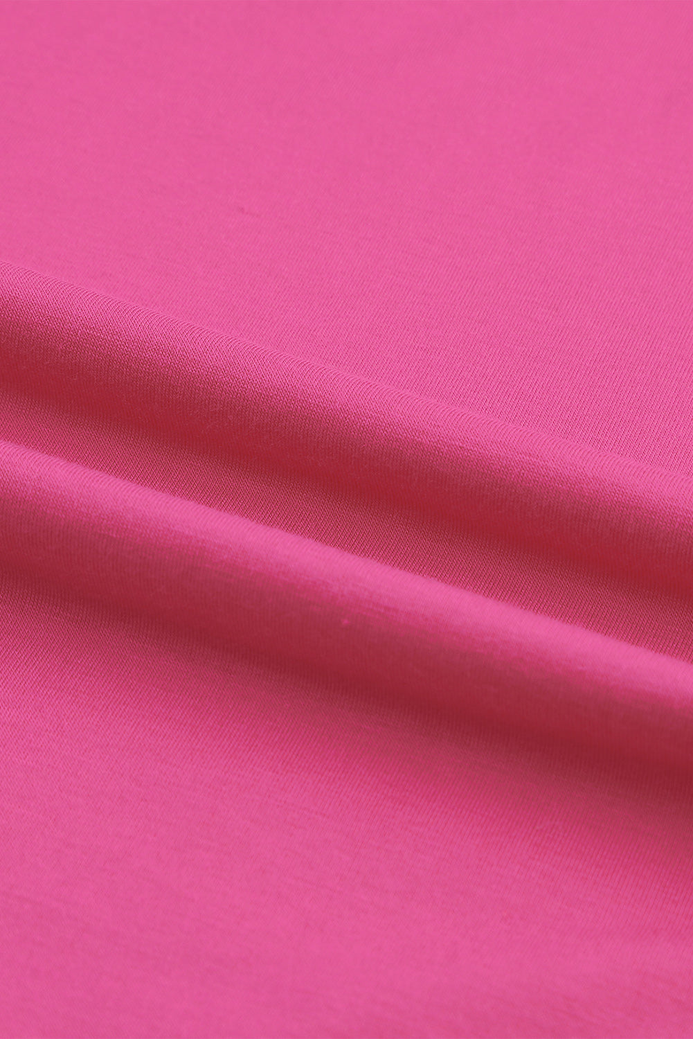 Rožnata asimetrična majica s križanimi rokavi na eno ramo