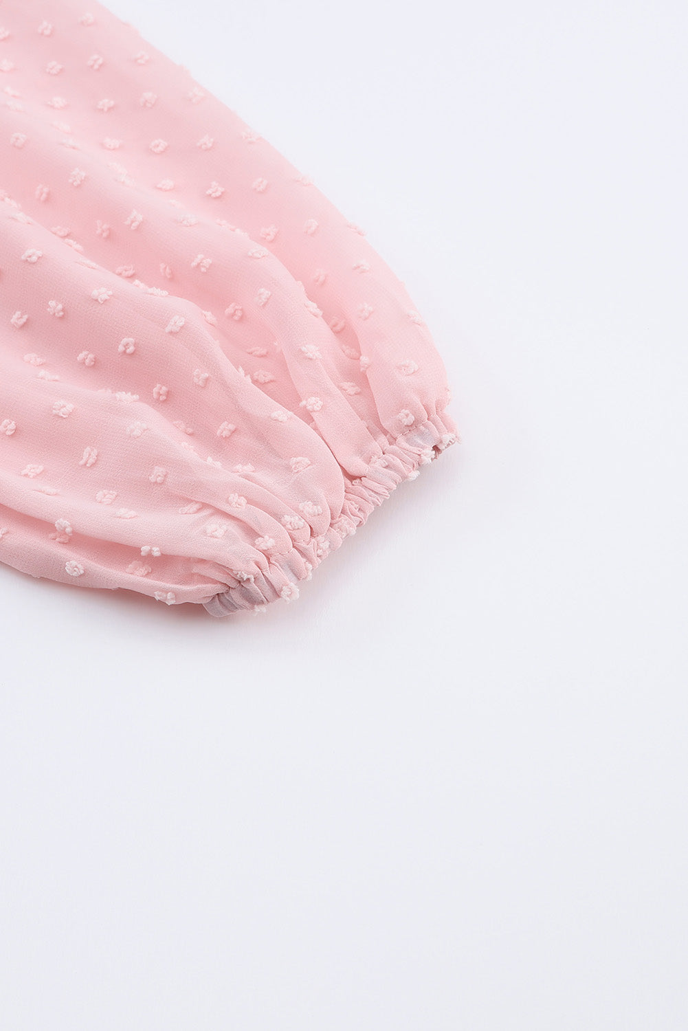 Rožnata mini obleka s švicarskimi pikami in puf rokavi