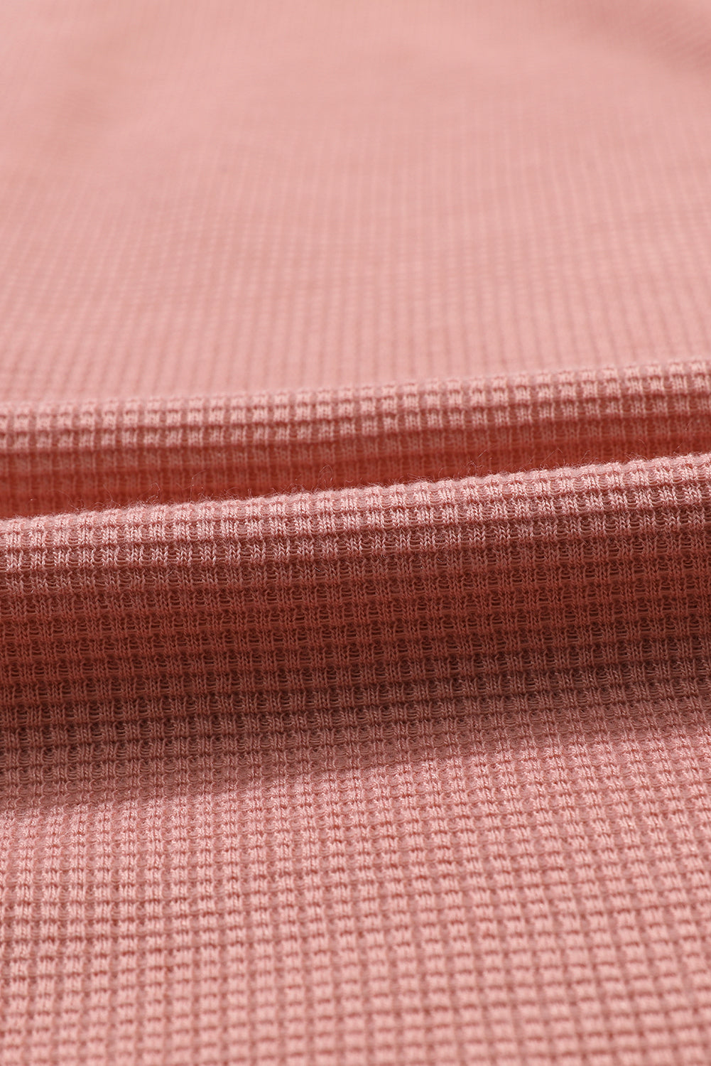 Rožnata pletena žepka z naborki