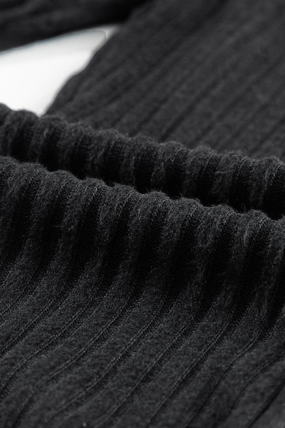 Crne rebraste teksturirane pletene tajice sa širokim pojasom