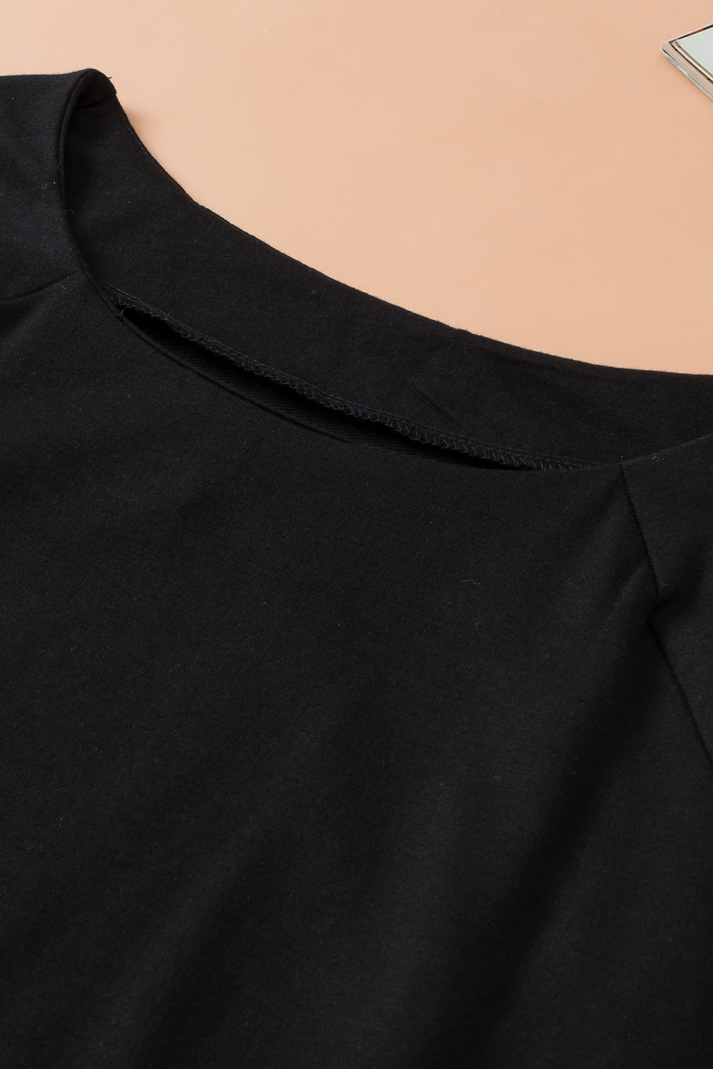 Schwarzes, einfarbiges, lässiges Raglan-Langarm-T-Shirt mit Rundhalsausschnitt