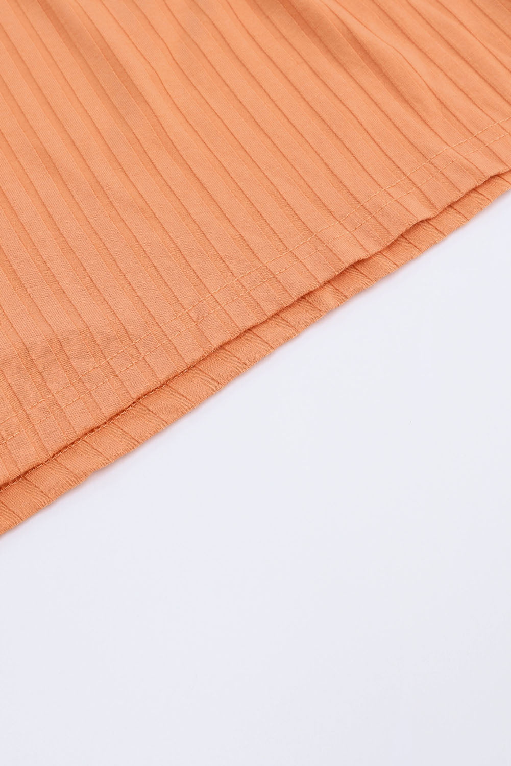 Barboteuse orange côtelée à manches longues et taille avec cordon de serrage