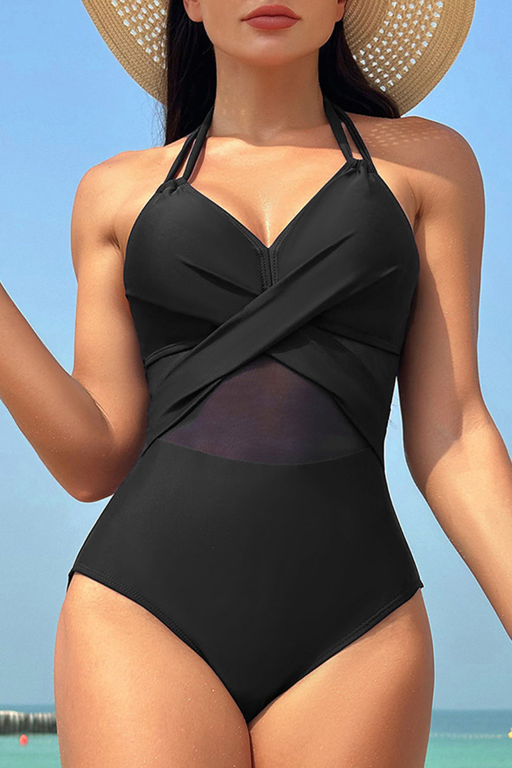 Crni jednodijelni kupaći kostim s mrežastim umetkom s halterom i križnim prednjim dijelom