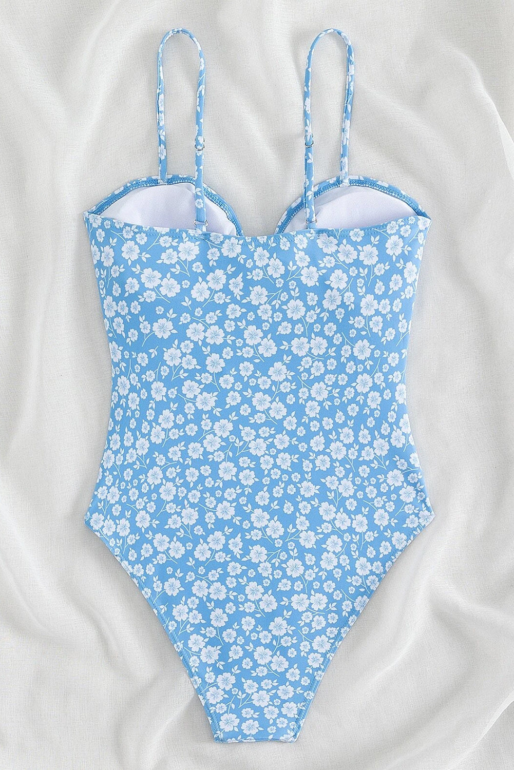 Costume da bagno intero con stampa floreale azzurro cielo e nodo scavato sul davanti