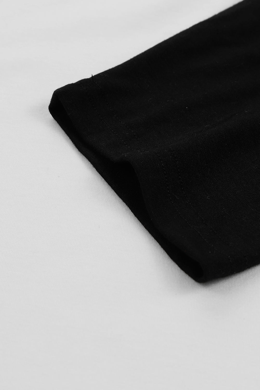 Haut pull noir à manches raglan et blocs de couleurs