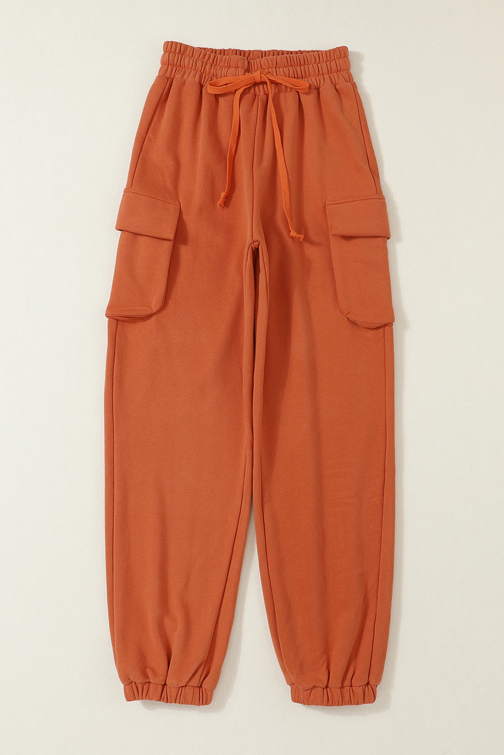 Oranžne jogger hlače z vrvico in kargo žepi