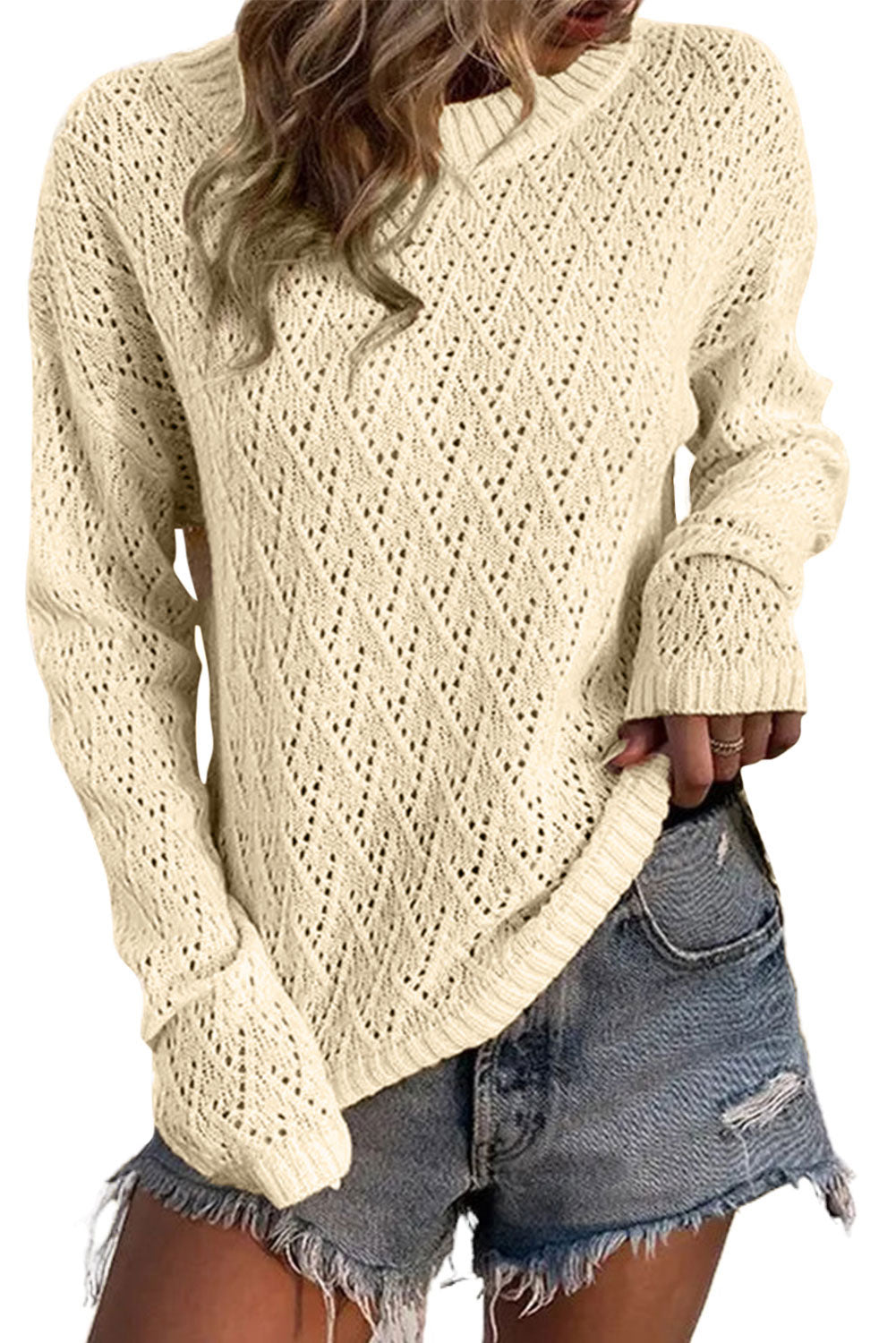 Pull beige à bordure côtelée en tricot à œillets