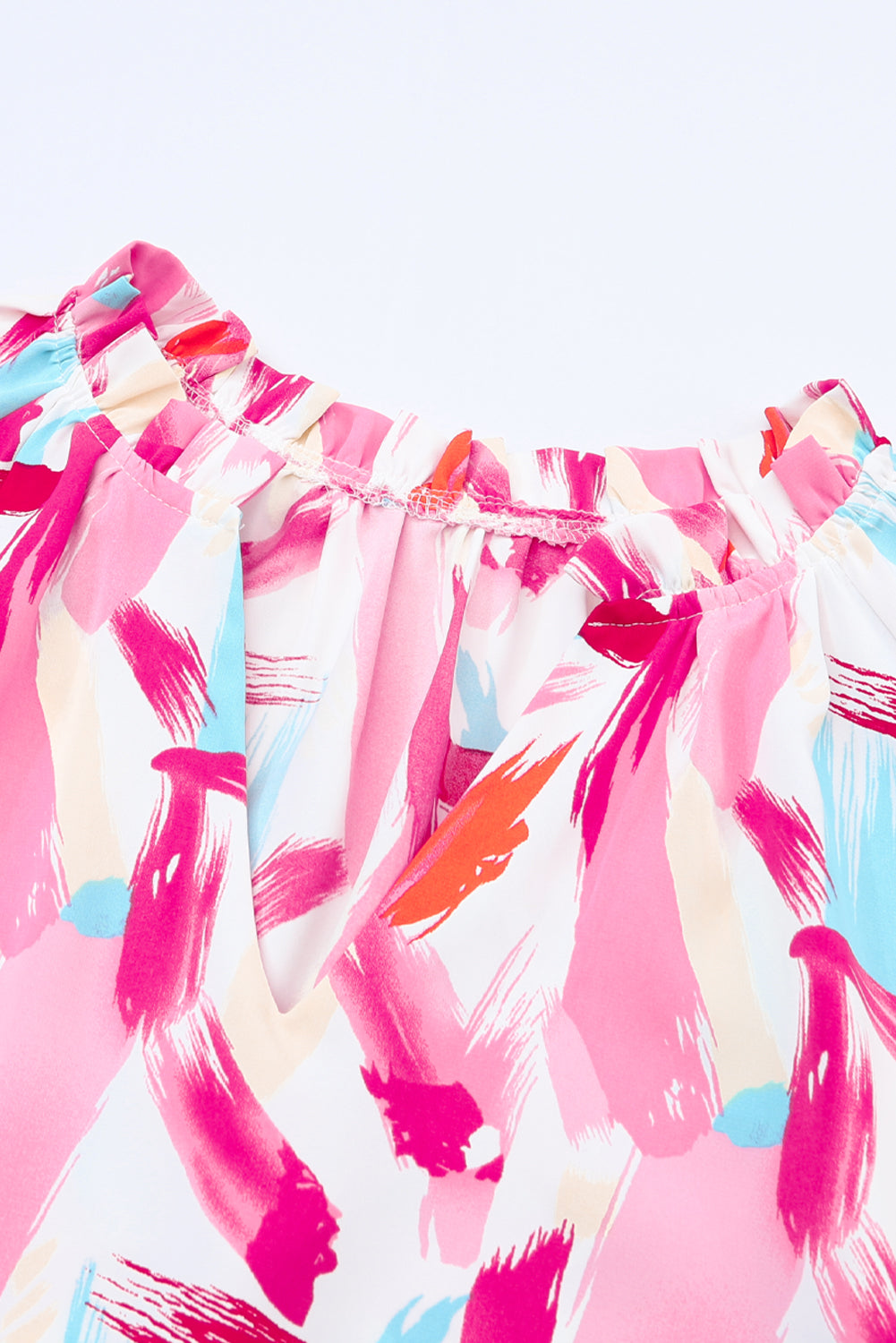 Rosafarbene, locker sitzende Bluse mit abstraktem Pinselmuster