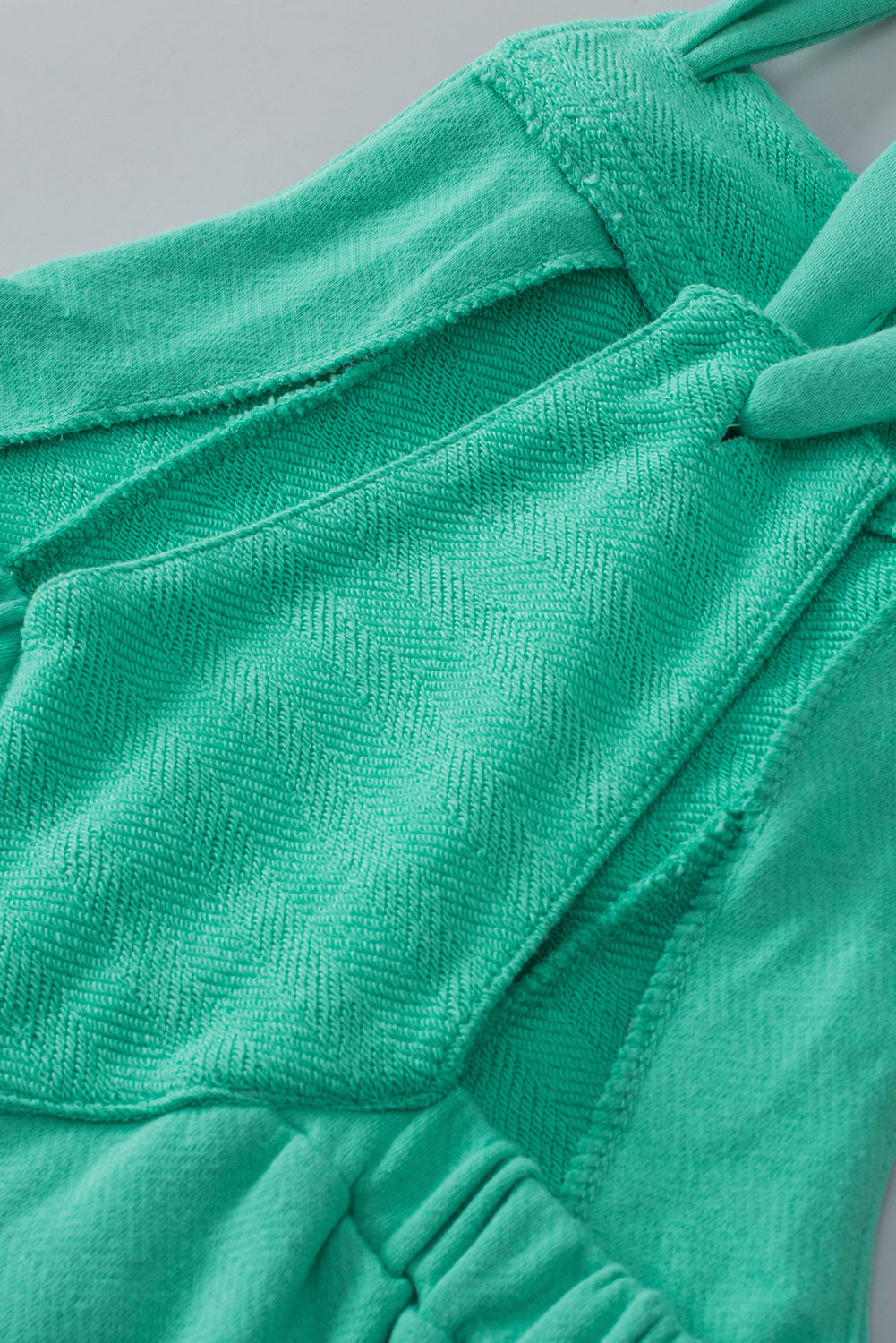 Mint zelene hlače iz frotirja z vozlanimi naramnicami