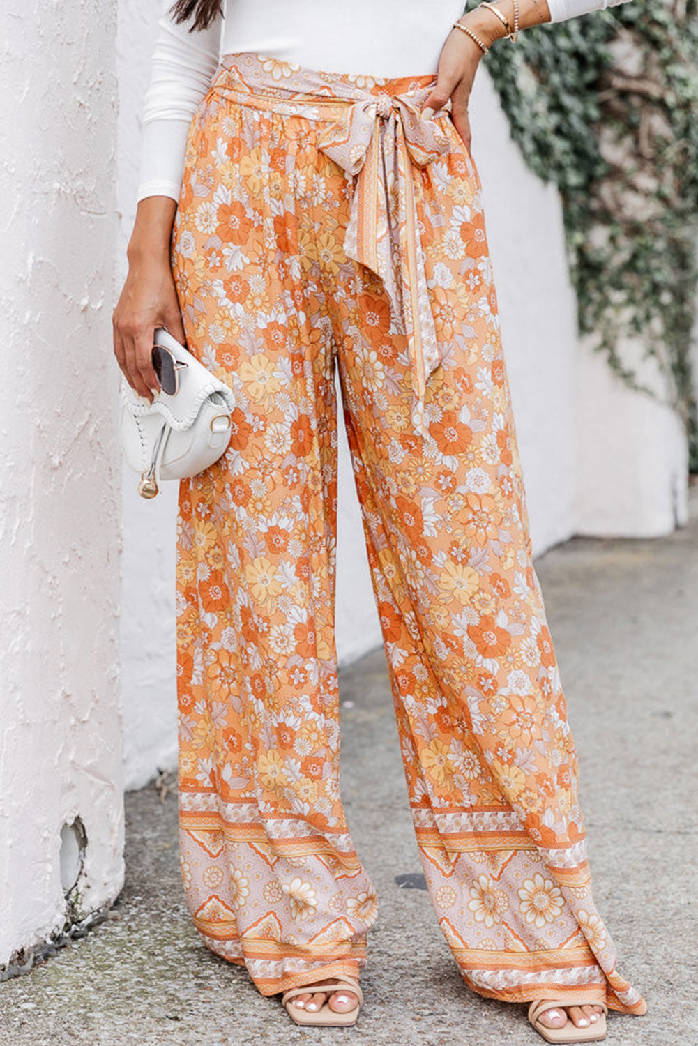 Grenivkino oranžne široke boho hlače s cvetličnim prirezkom