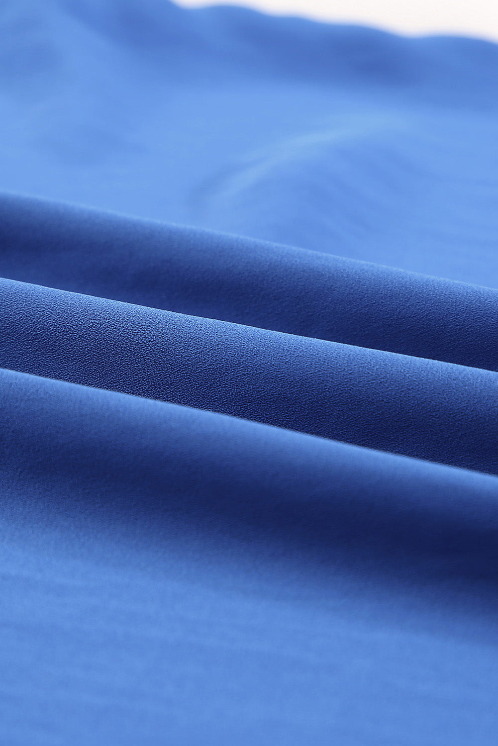 Camicetta ampia plissettata con collo diviso blu