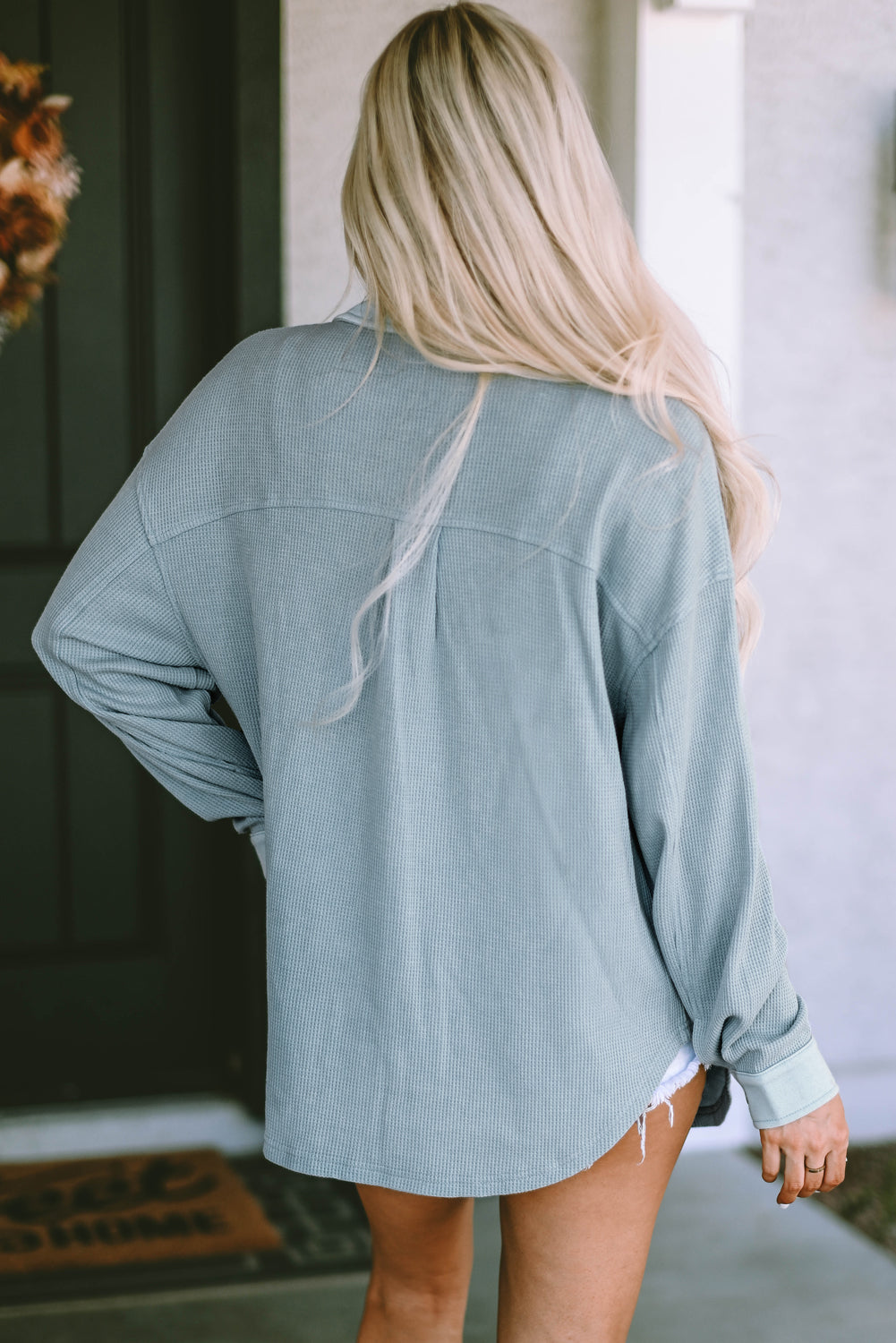 Veste boutonnée avec poches en tricot gaufré bleu ciel