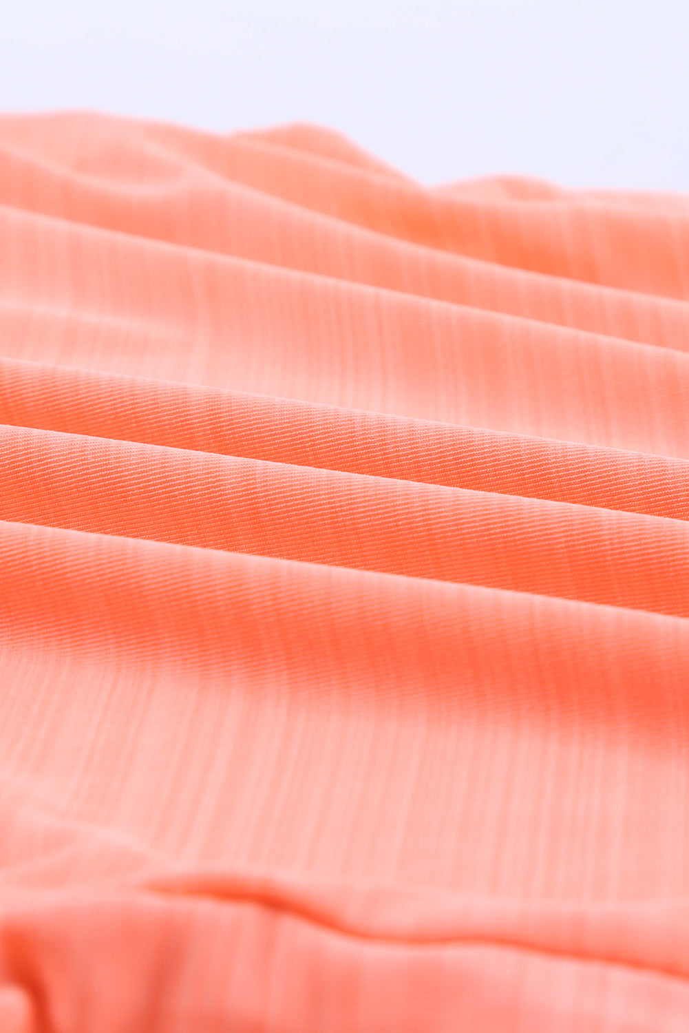Rožnate podložene tankini kopalke z geometrijskim vzorcem