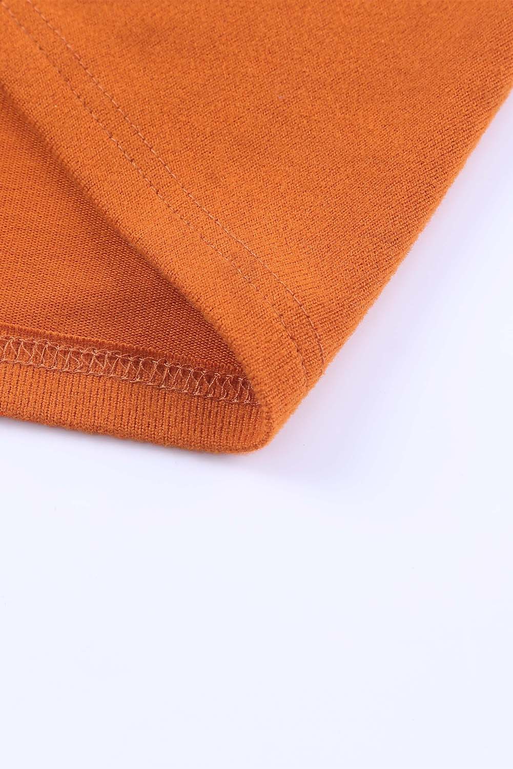 Top a maniche lunghe patchwork color block con tasche arancioni