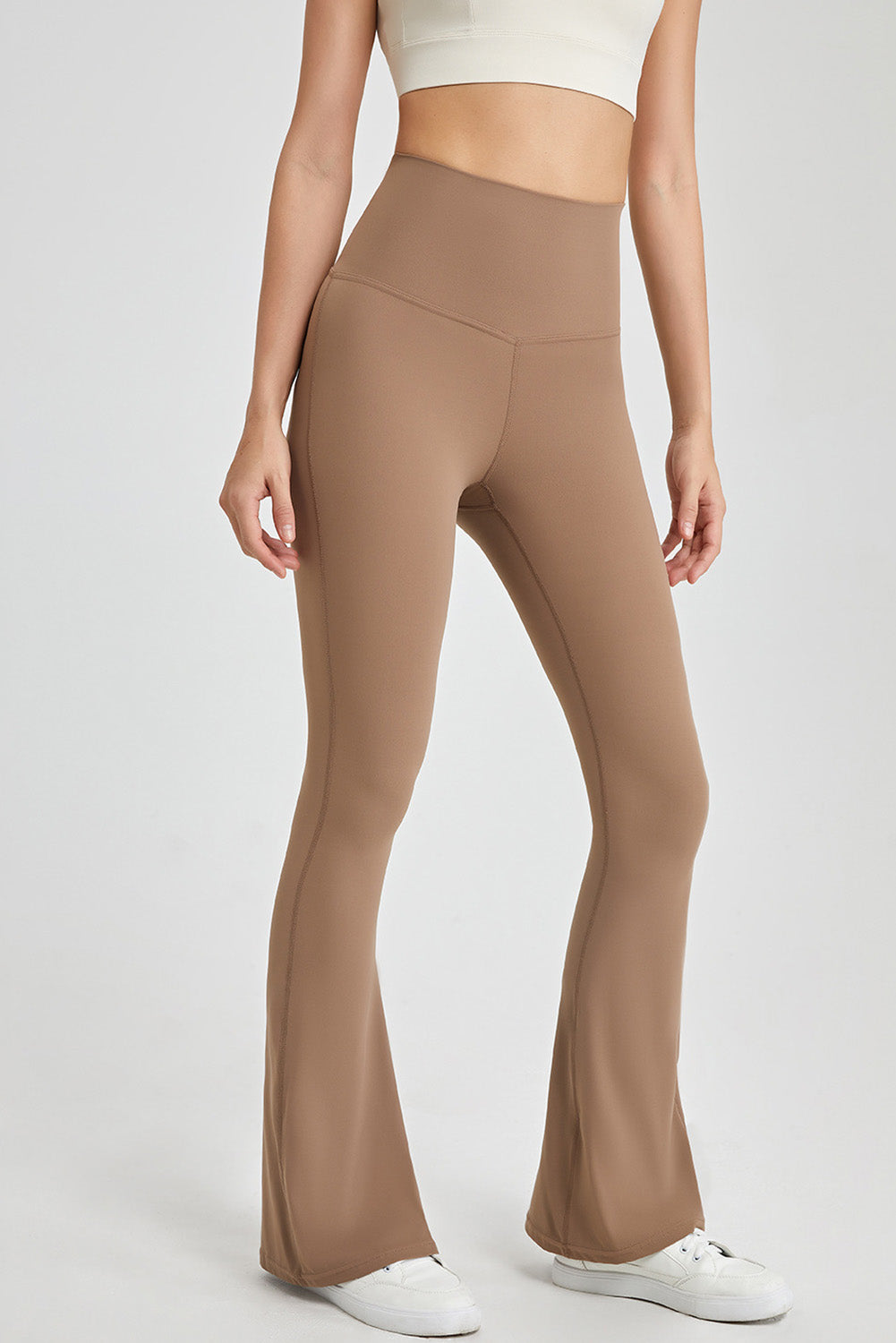 Leggings svasati attivi con cintura incrociata sul retro beige francese chiaro