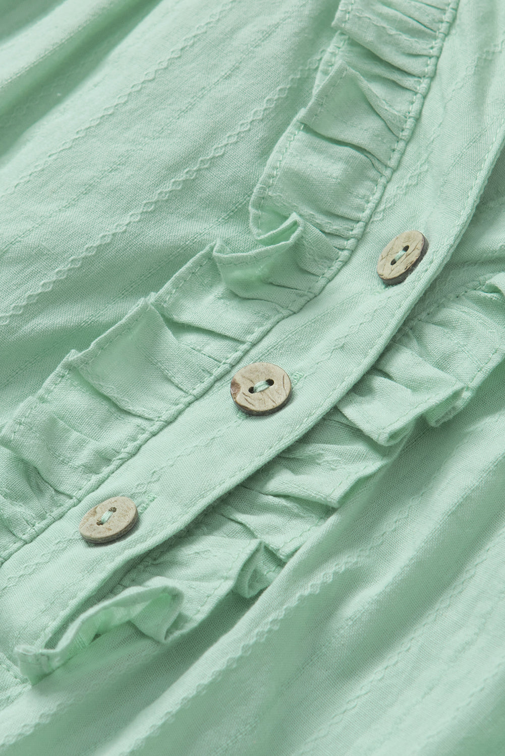 Grün bedruckte, florale Patchwork-Bluse mit Rüschen und Schlitz