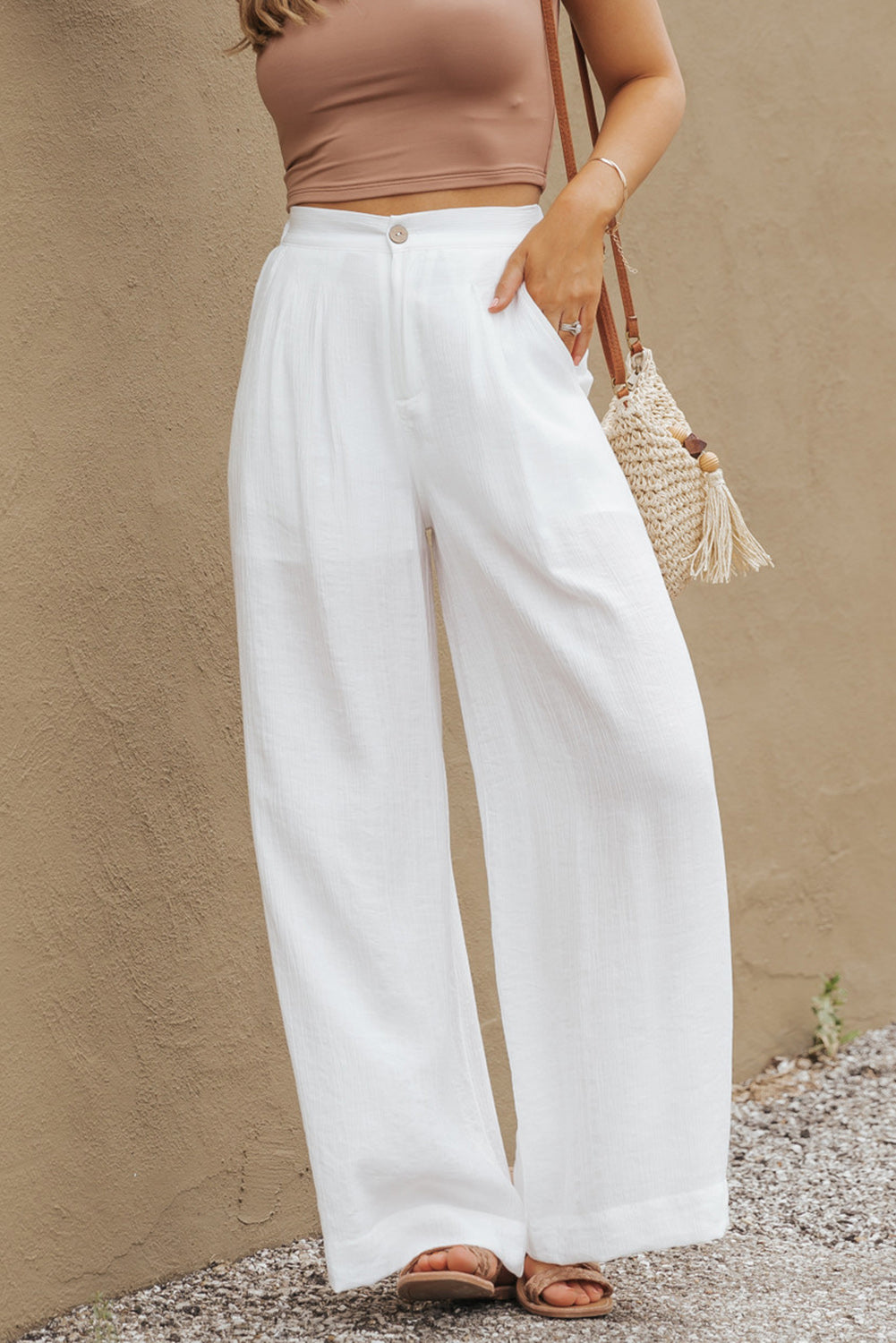 Bijele jednobojne široke plisirane hlače s elastičnim strukom