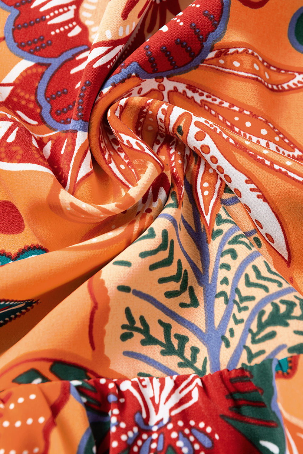 Orangefarbenes Blumenkleid mit Blasenärmeln und Gürtel
