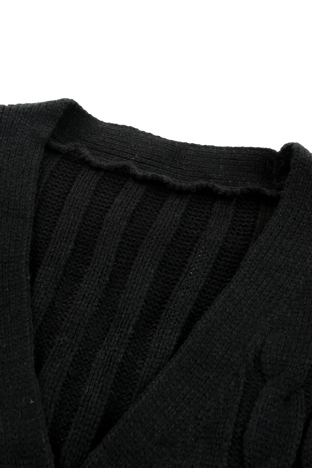Črna pletena jopica z žepom in barvnim blokom