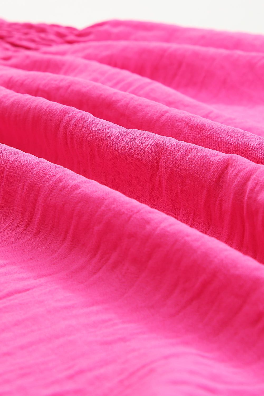 Camicetta peplo con maniche svolazzanti e volant smock rosa