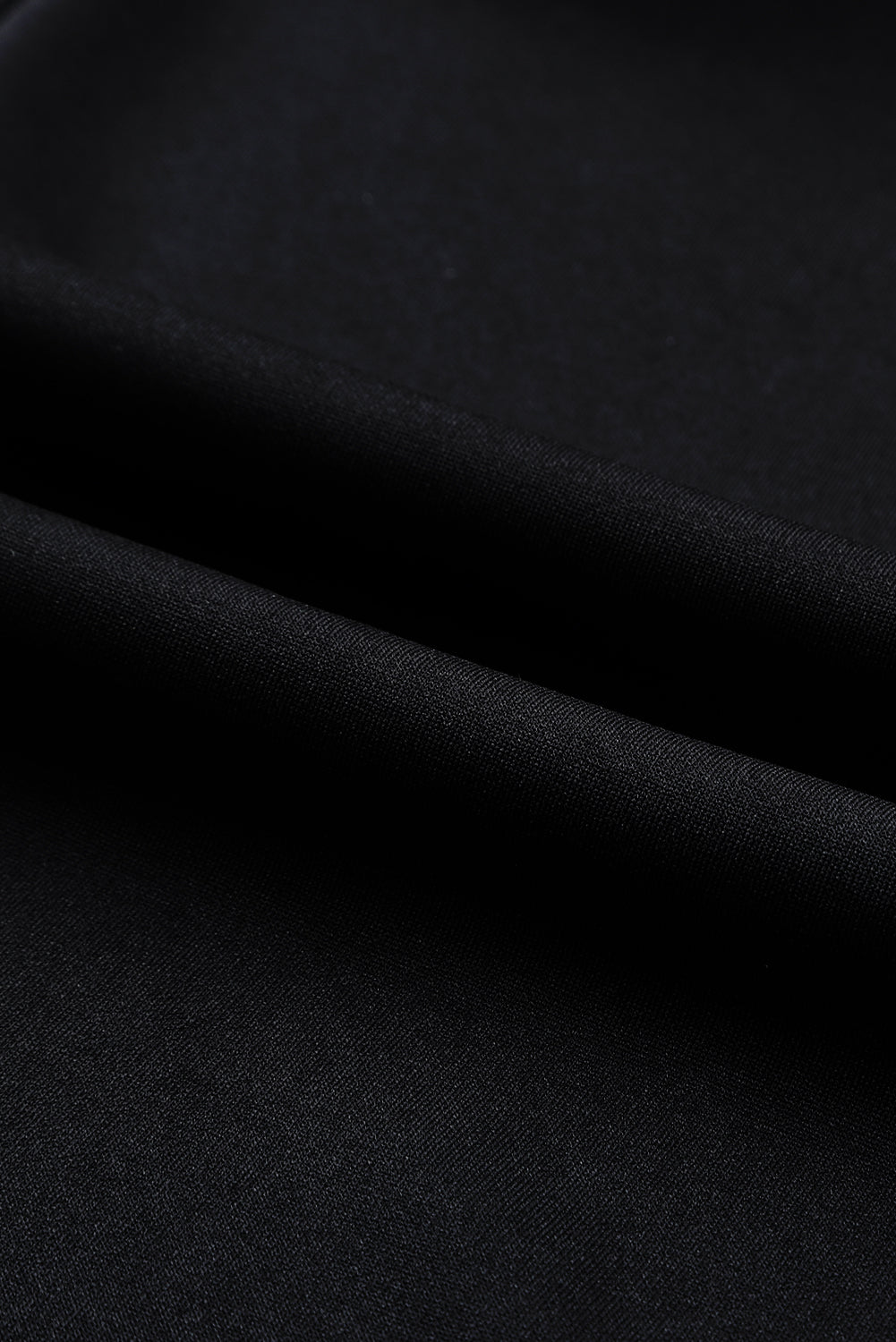 Črn enobarven širok kombinezon brez rokavov