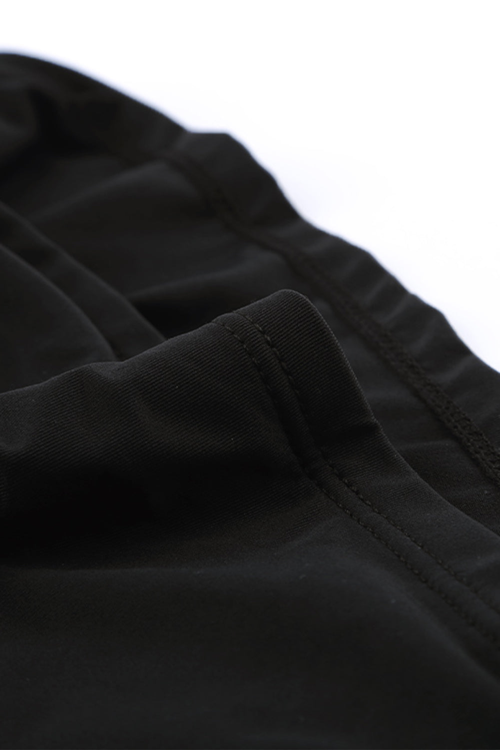 Crni kupaći kostim tankini s visokim izrezom i dubokim izrezom