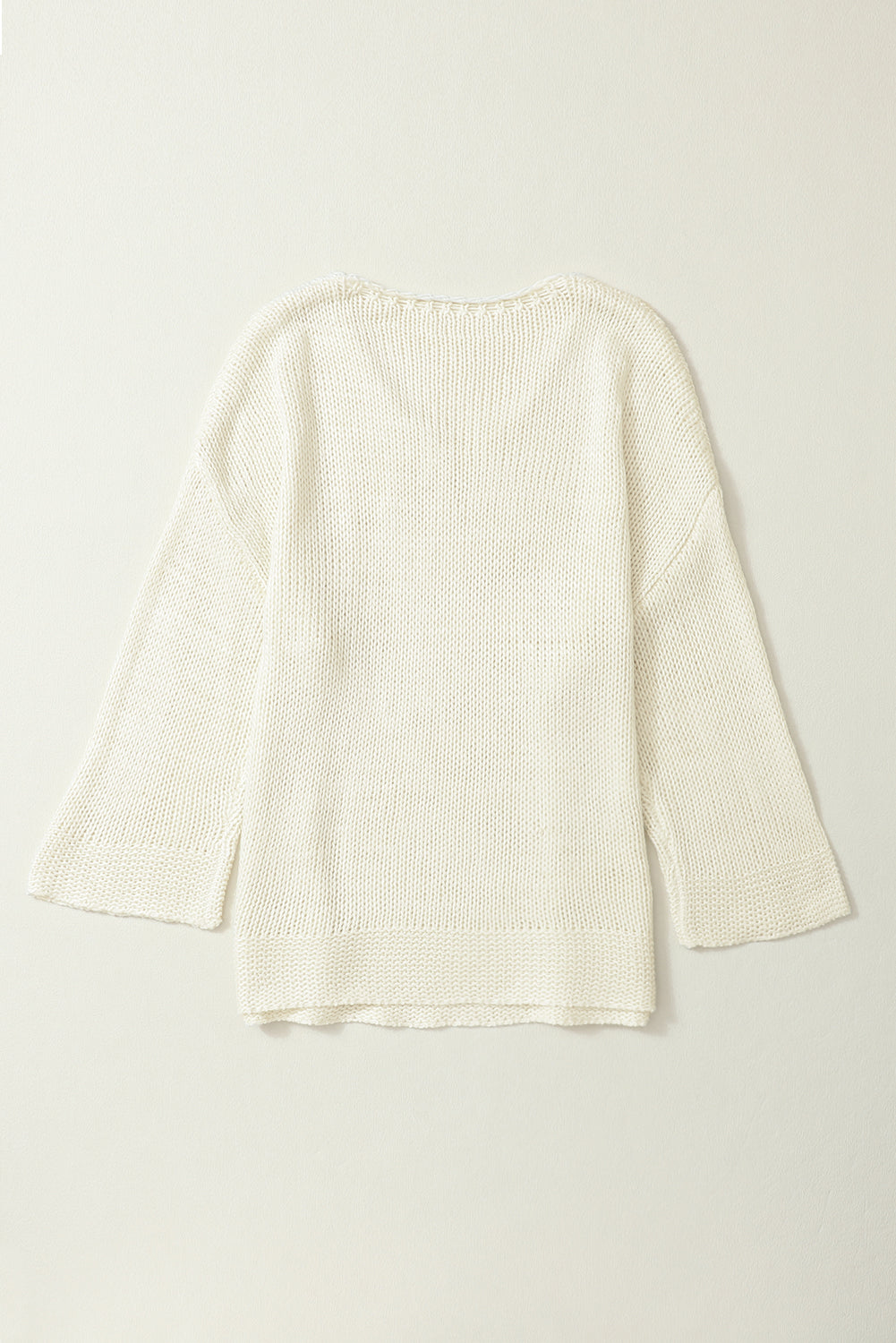 Široki pleteni džemper s V izrezom boje marelice