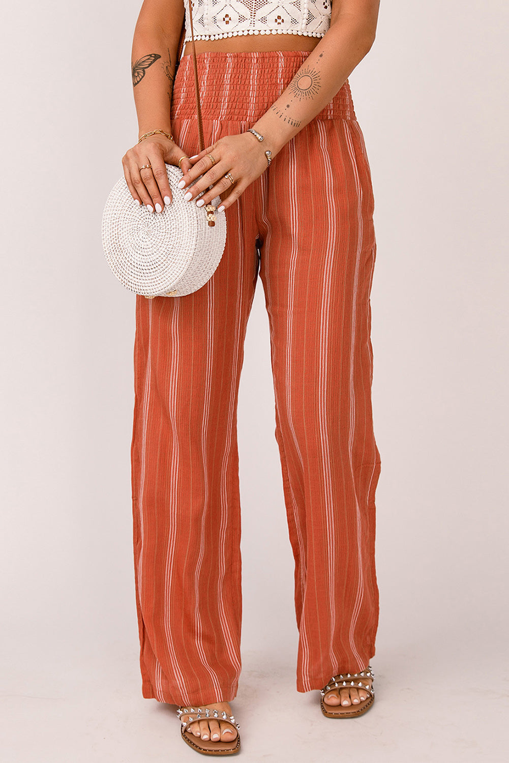 Narančaste prugaste hlače s ravnim nogavicama visokog struka