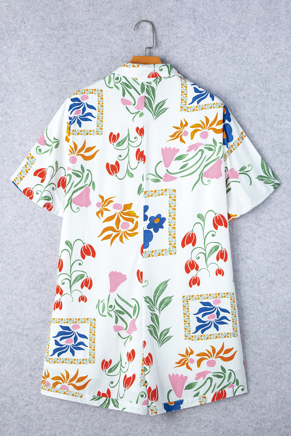 Barboteuse blanche à col chemise avec poches et col fendu à imprimé floral
