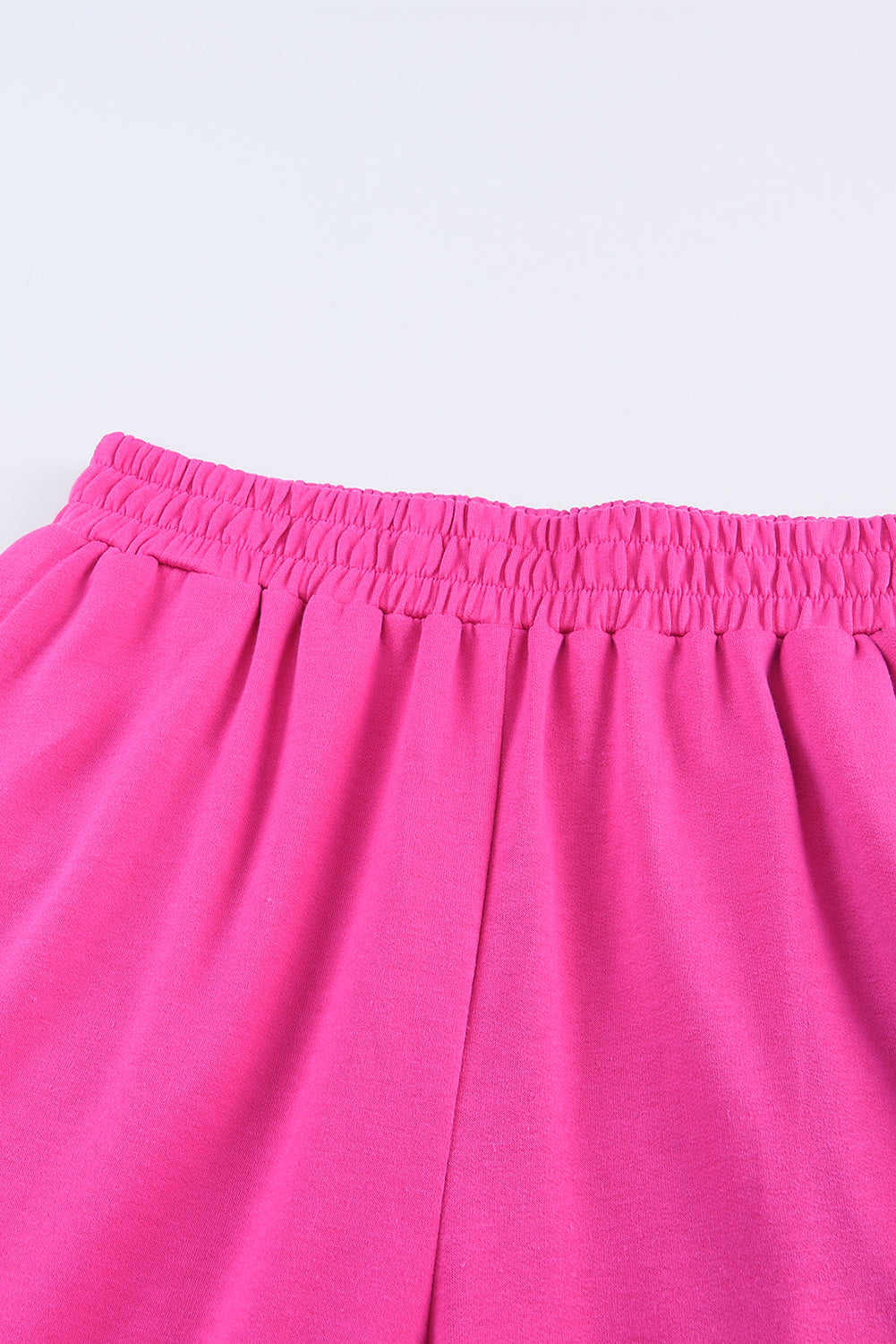 Pantaloni a gamba larga con tasche in vita elastica rosa